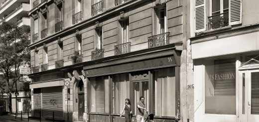 Small Family in front of Building on the Street in Europe