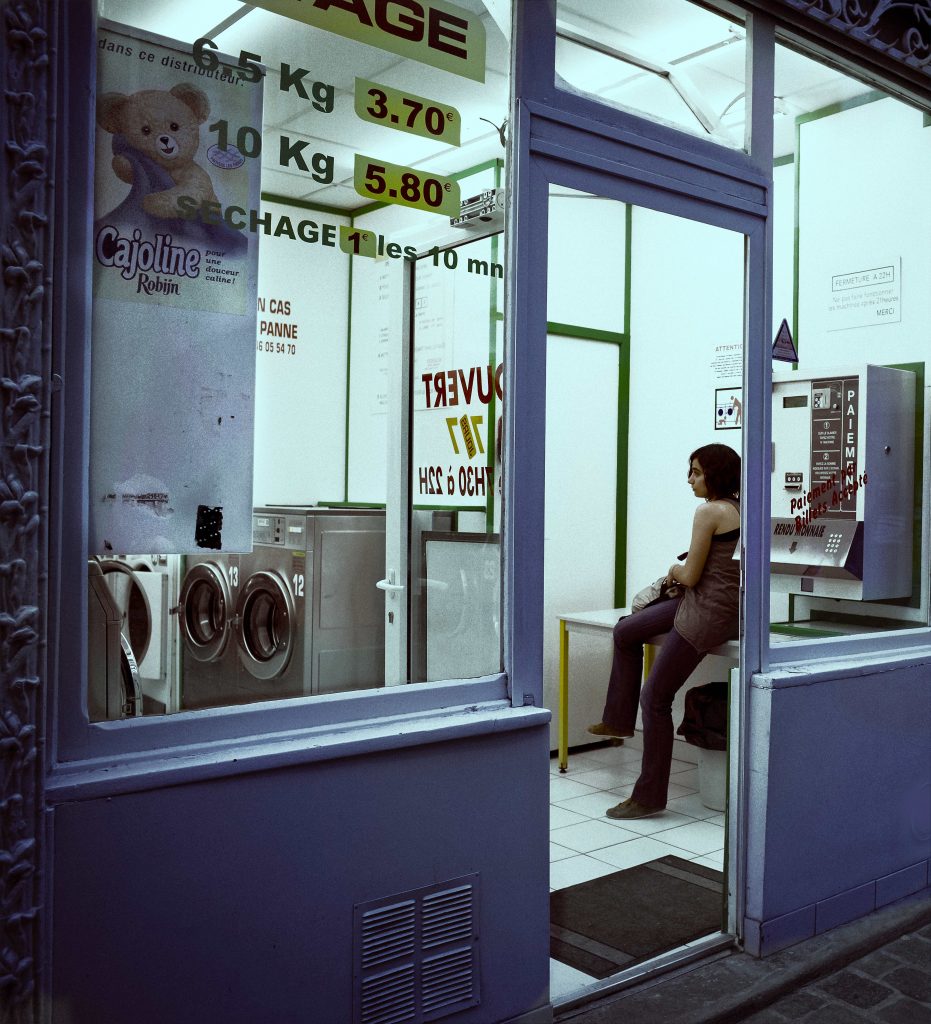 Young Woman in the Laundromat
